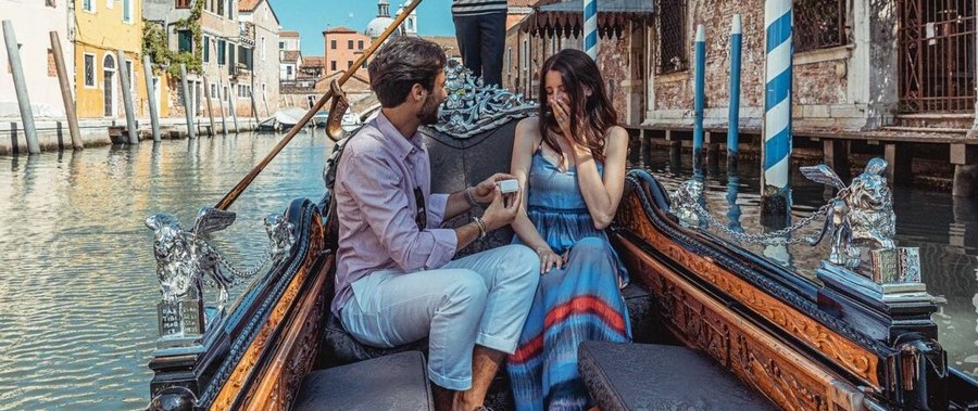 venice wedding proposal gondola on water couple
