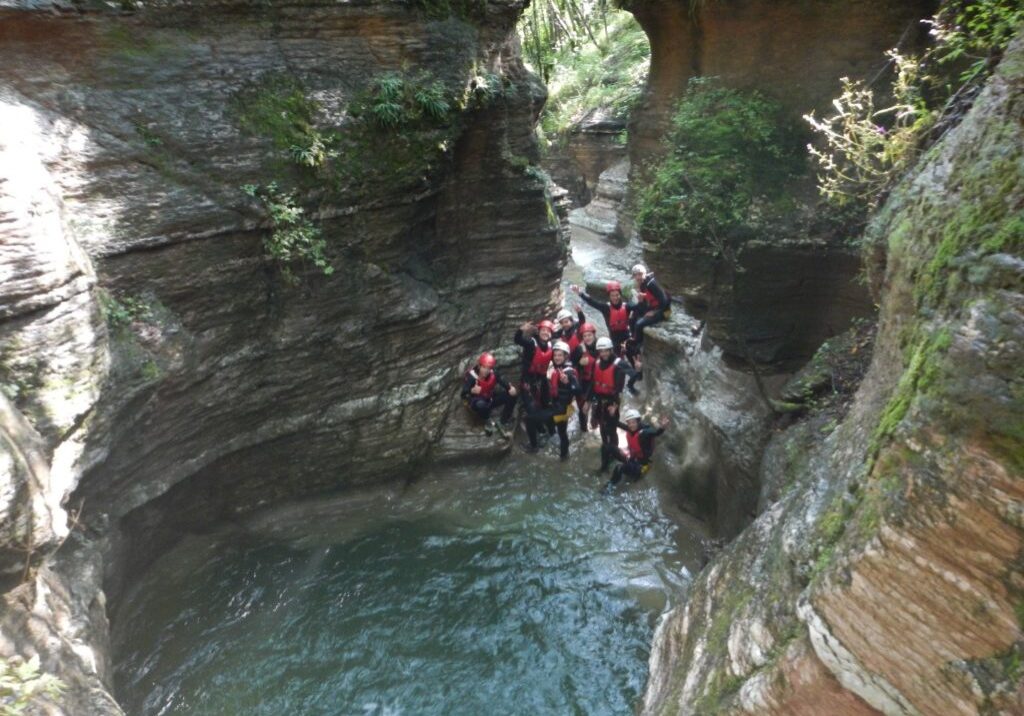 group of people canyoning in dolomites